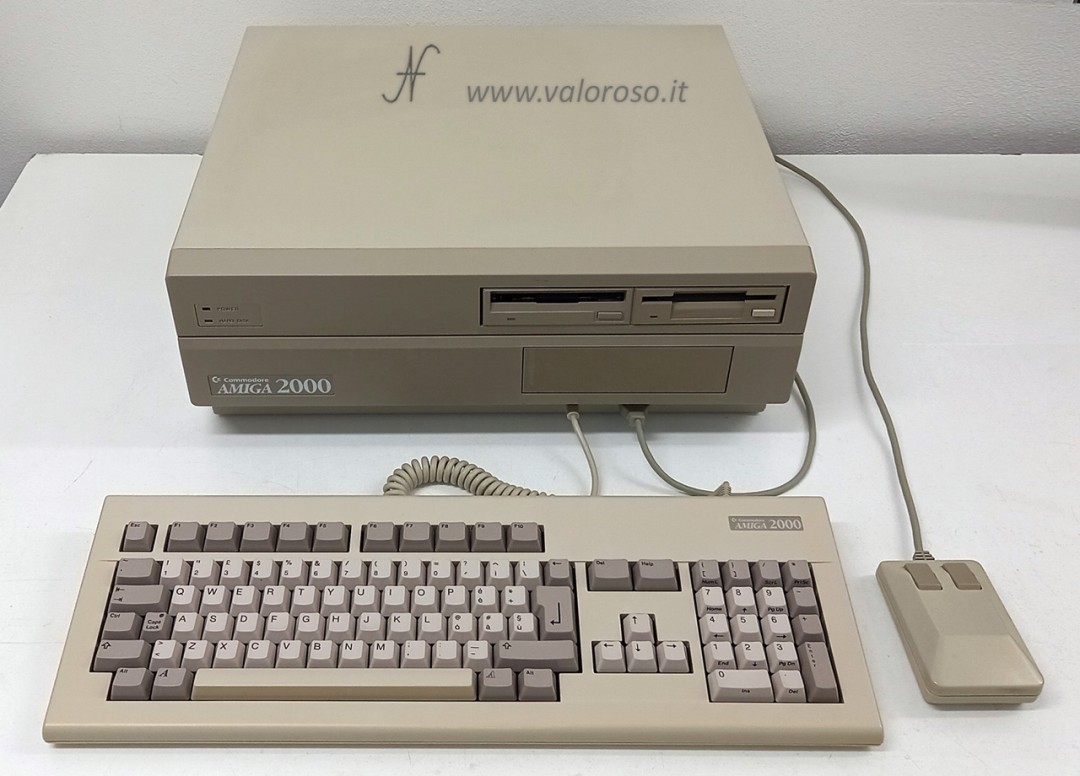 Amiga 2000, Commodore A2000, CBM A200, Italian keyboard, mouse, desktop CPU
Technical characteristics of the Amiga 2000
CPU: Motorola MC68000, 7.09379 MHz (PAL) or 7.15909 MHz (NTSC)
Chipsets:
    for motherboard rev 4: OCS (Original Chip Set): Agnus (memory controller and blitter), Denise (video), Paula (audio and I/O)
    for motherboard rev 4.1, 4.2, 4.3, 4.4, 4.5, 6, 6.1, 6.2: OCS (Original Chip Set): Fat Agnus (memory controller and blitter), Denise (video), Paula (audio and I/O)
    for motherboard rev 6.3, 6.4, 6.5: ECS (Enhanced Chip Set): Fat Agnus (memory controller and blitter), Super Denise (video), Paula (audio and I/O)
ROM:
    for motherboard rev 4, 4.1, 4.2, 4.3, 4.4, 4.5, 6, 6.1, 6.2: 256 KB
    for motherboard rev 6.3, 6.4, 6.5: 512 KB
Software included in ROM: KickStart 1.2, 1.3 or 2.04 (on my computer, there is version 1.3)
Storage media: up to n. 2 internal floppy disk drives, possibility of hard disk with separate controller
RAM: 512KB / 1MB expandable (my computer has 1MB RAM)
Graphics: Denise / Super Denise
Graphics mode: 320 x 256 up to 640 x 512 pixels, up to 4096 colors
Audio: Paula, 4 channels, stereo output
Keyboard: 96-key QWERTY, with arrows, function keys and numeric keypad
Expansion Connectors (Internal):
    4 PC ISA connectors: 2 XT (62 pin, 8 bit) and 2 AT (62+36 pin, 16 bit)
    1 86-pin expansion for CPU / MMU
    5 100 pin Zorro II connectors
    1 36+36 pin expansion for video
    1 34 pin connector for 3.5″ floppy disk
    1 internal 26 pin serial
Expansion ports (rear):
    1 male DB23 video, analog RGB
    1 parallel DB25 female, Centronics
    1 external floppy disk drive, DB23 female
    1 RCA monochrome CVBS composite video
    2 RCA stereo audio
    1 male DB25 serial, RS232
Expansion Ports (Front):
    1 keyboard, 5-pole DIN
    2 mice and joysticks, DB9 male